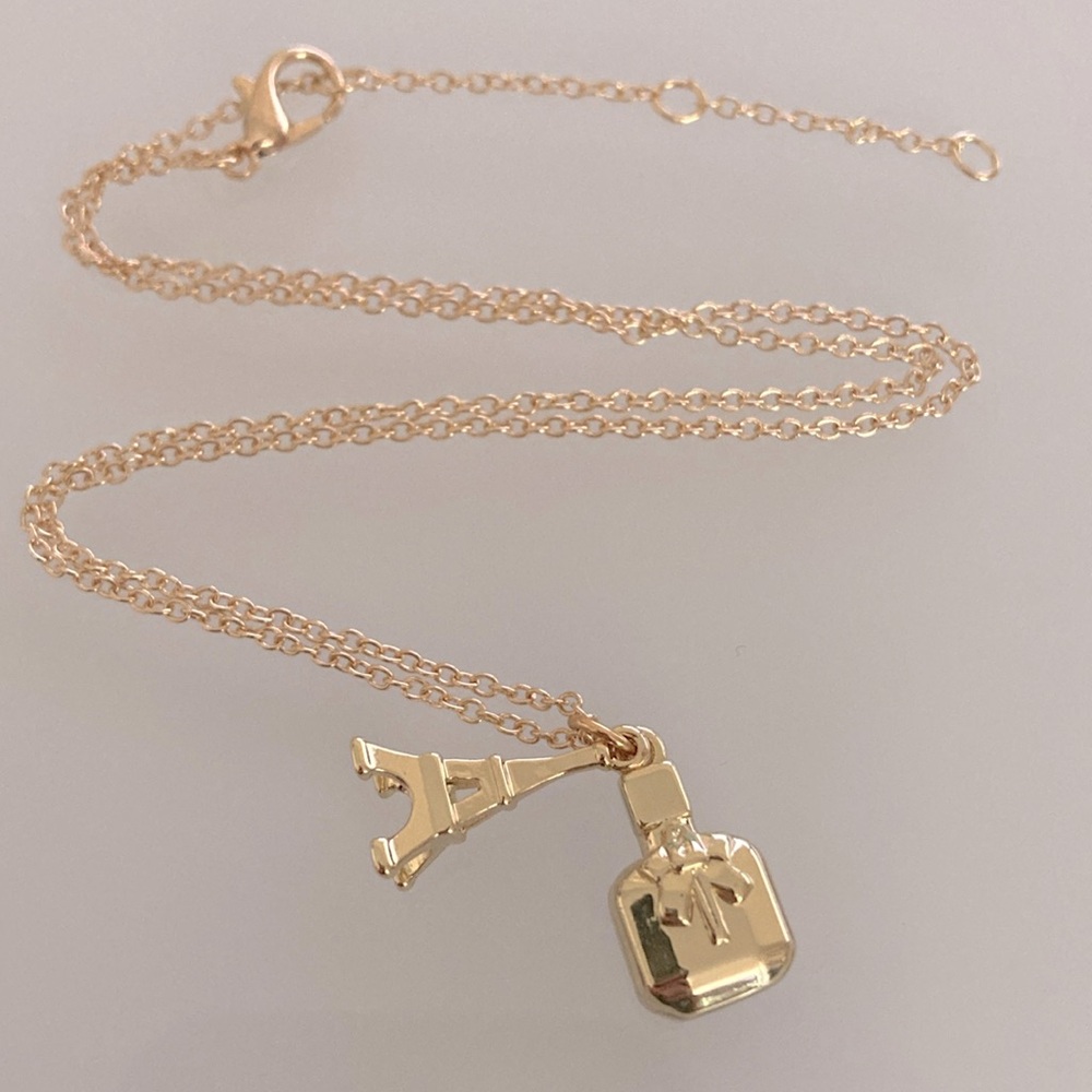 Yves Saint Laurent Gold Eiffel Tower and Perfume Bottle Necklace - Picture 3 of 5